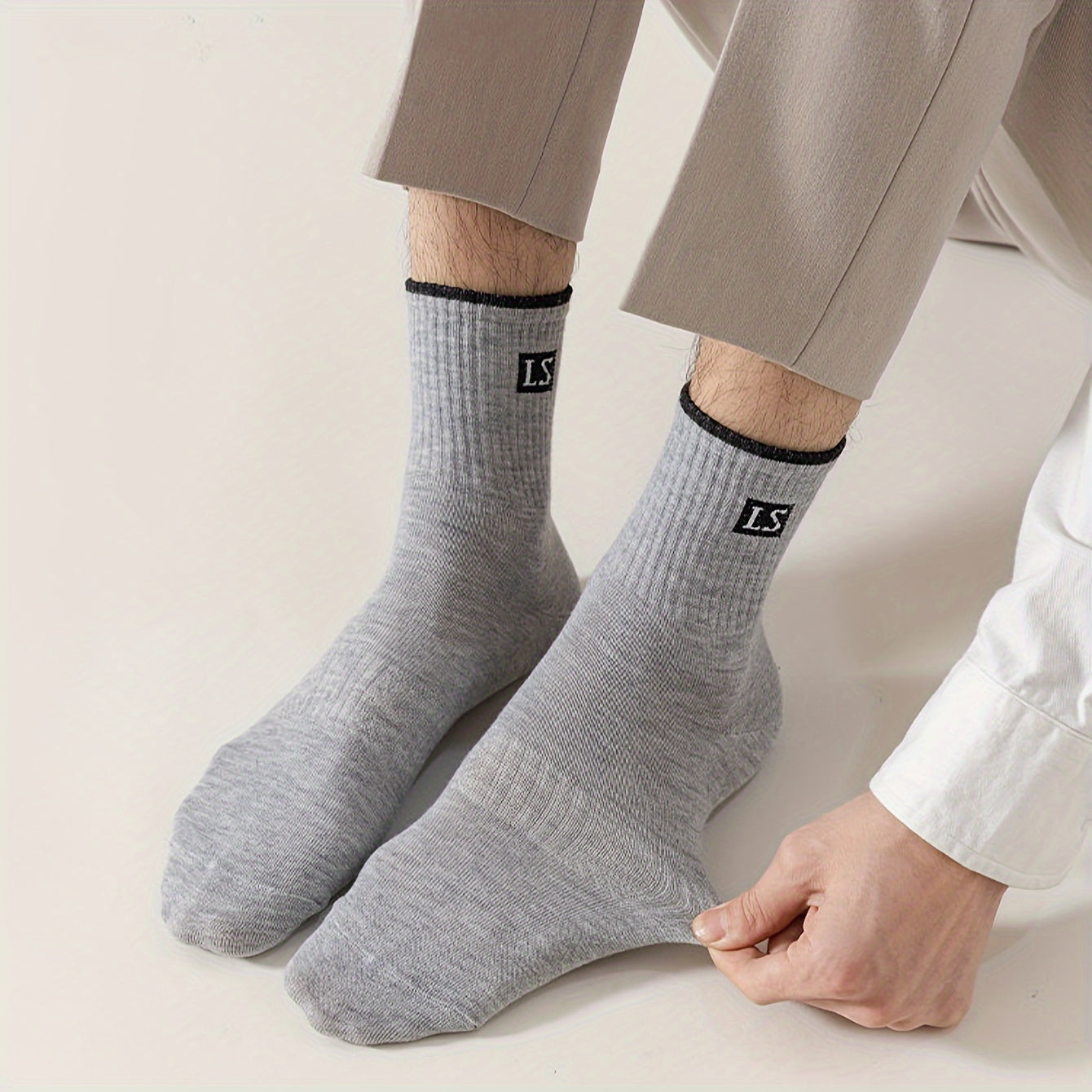 5 pairs of men's trendy solid crew socks, breathable and comfy for outdoor and all-season wear.