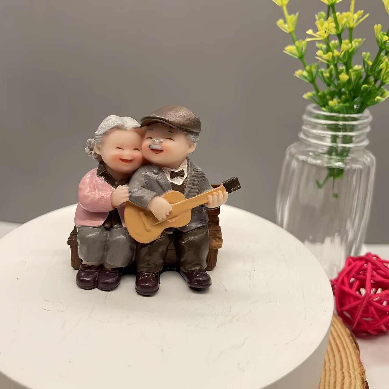 Resin figurine of charming elderly couple, ideal for home or office decor. Perfect Valentine's Day or anniversary gift.