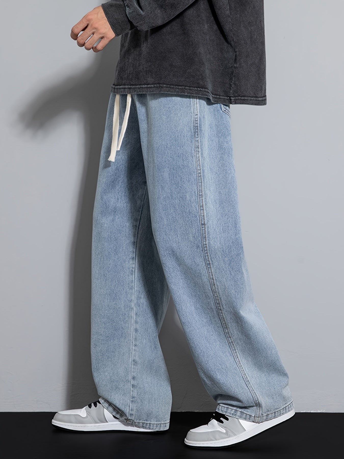 Men's wide leg denim jeans with drawstring waist, loose fit for hip-hop style.