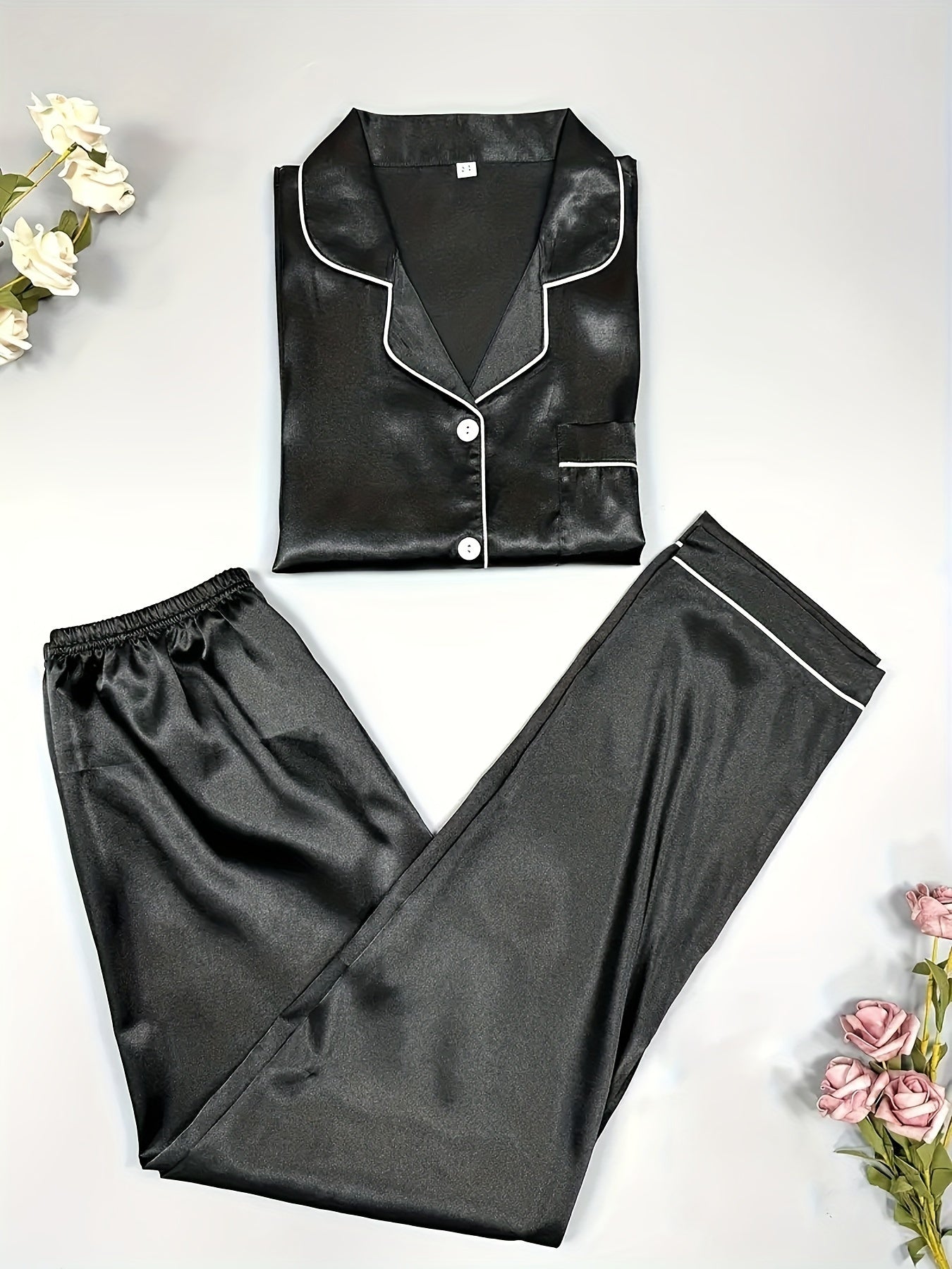 Solid satin lounge set with long sleeve button-up top and elastic pants for women's loungewear.