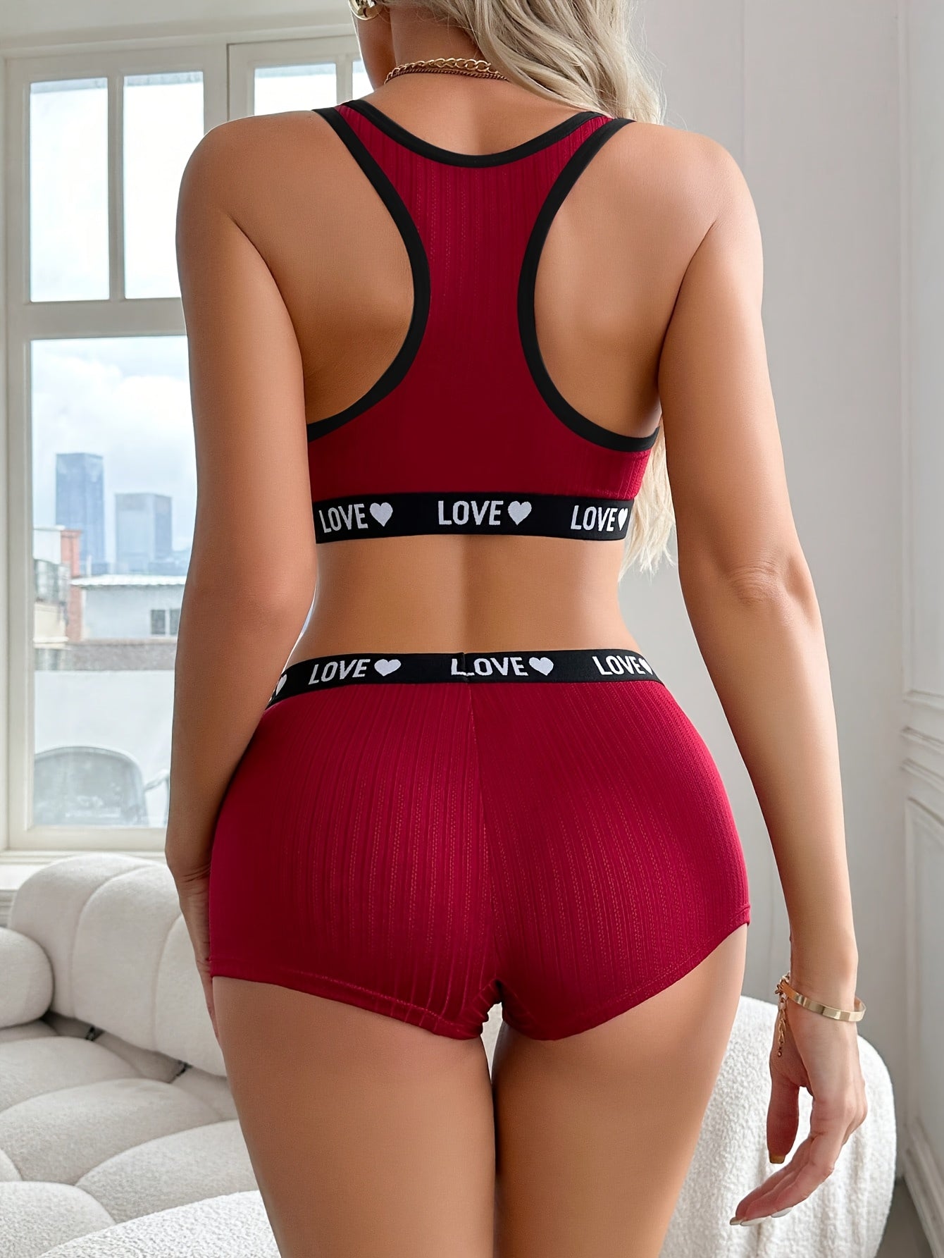 Athletic-inspired lingerie set for women featuring a tank bra and boyshorts with letter print and contrast trim.