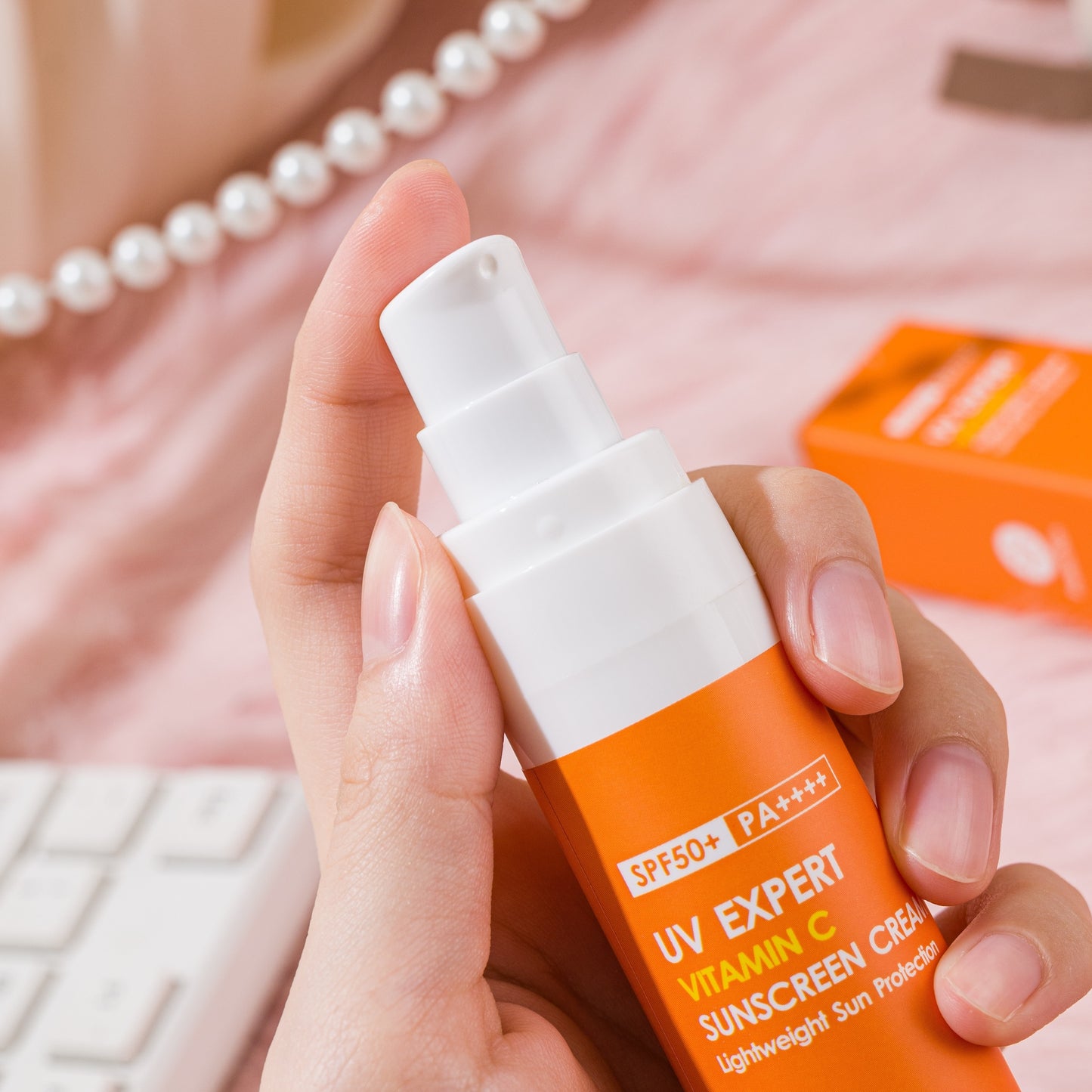 Non-greasy Vitamin C sunscreen for face and body, ideal for outdoor activities on sunny days.