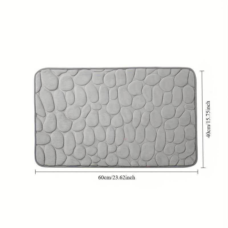 Memory foam bath rug with cobblestone design, ultra-absorbent and anti-slip for home and hotel use. Made of soft coral fleece, this bathroom rug is both practical and stylish.