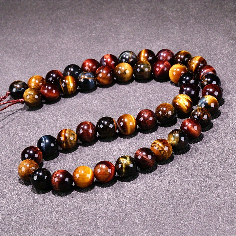 Loose round beads made from natural three-color Tiger Eye stone available for wholesale. Perfect for creating semi-finished DIY jewelry such as woven bracelets, necklaces, and sweater chains.