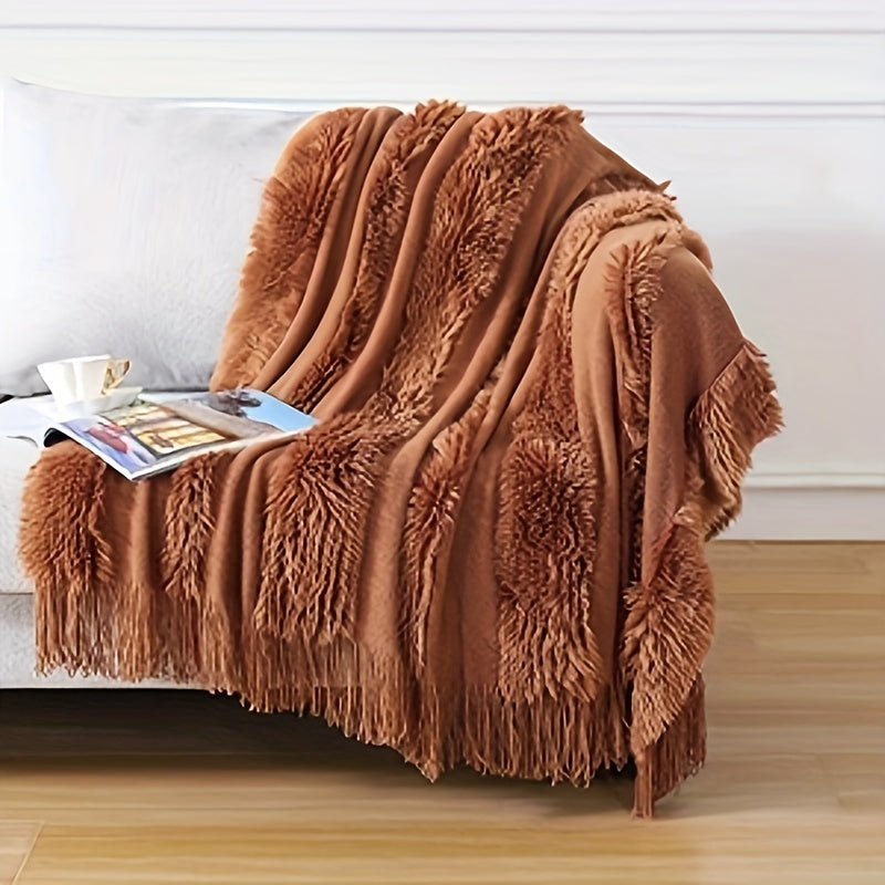 Stay cozy with this contemporary acrylic chunky knit throw blanket featuring tassels. With its solid pattern, lightweight plush texture, and machine washable design, this all-season throw is perfect for adding a touch of style and comfort to your couch