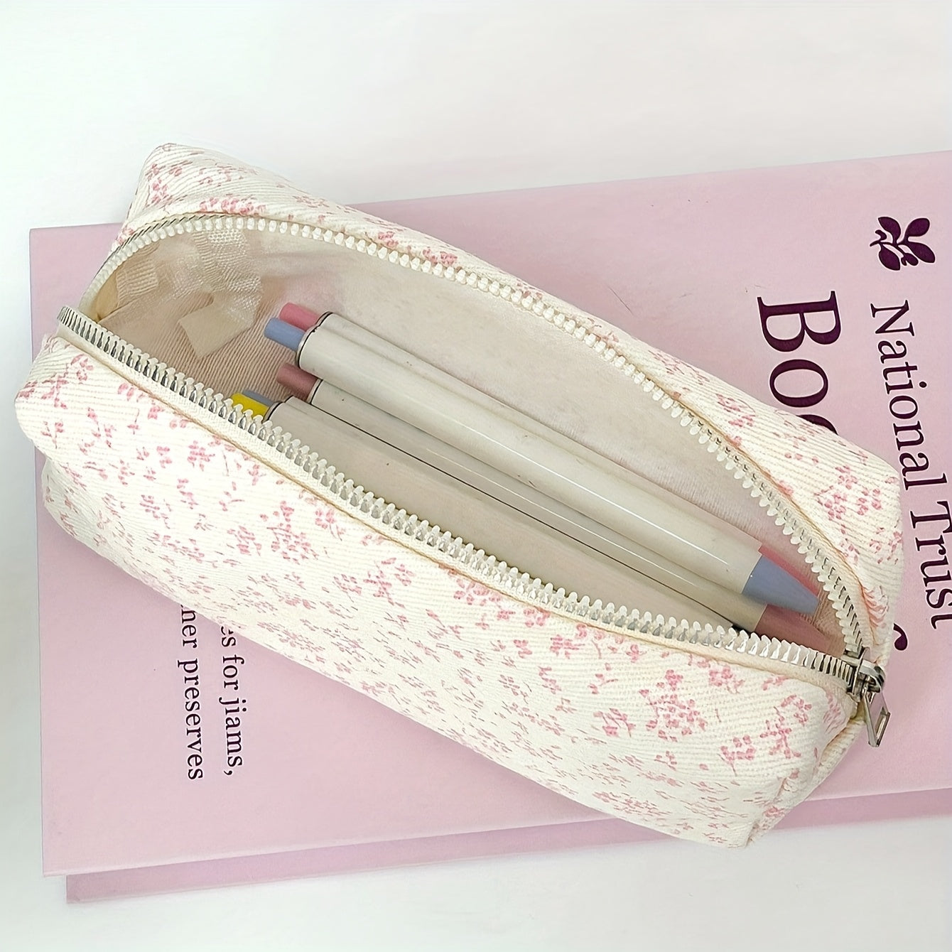 Canvas pencil case with floral print, high-capacity zipper for students and office organization.