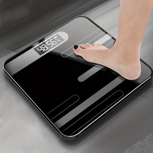 A sleek black digital body weight scale with LCD display, ideal for bathroom use, battery-powered