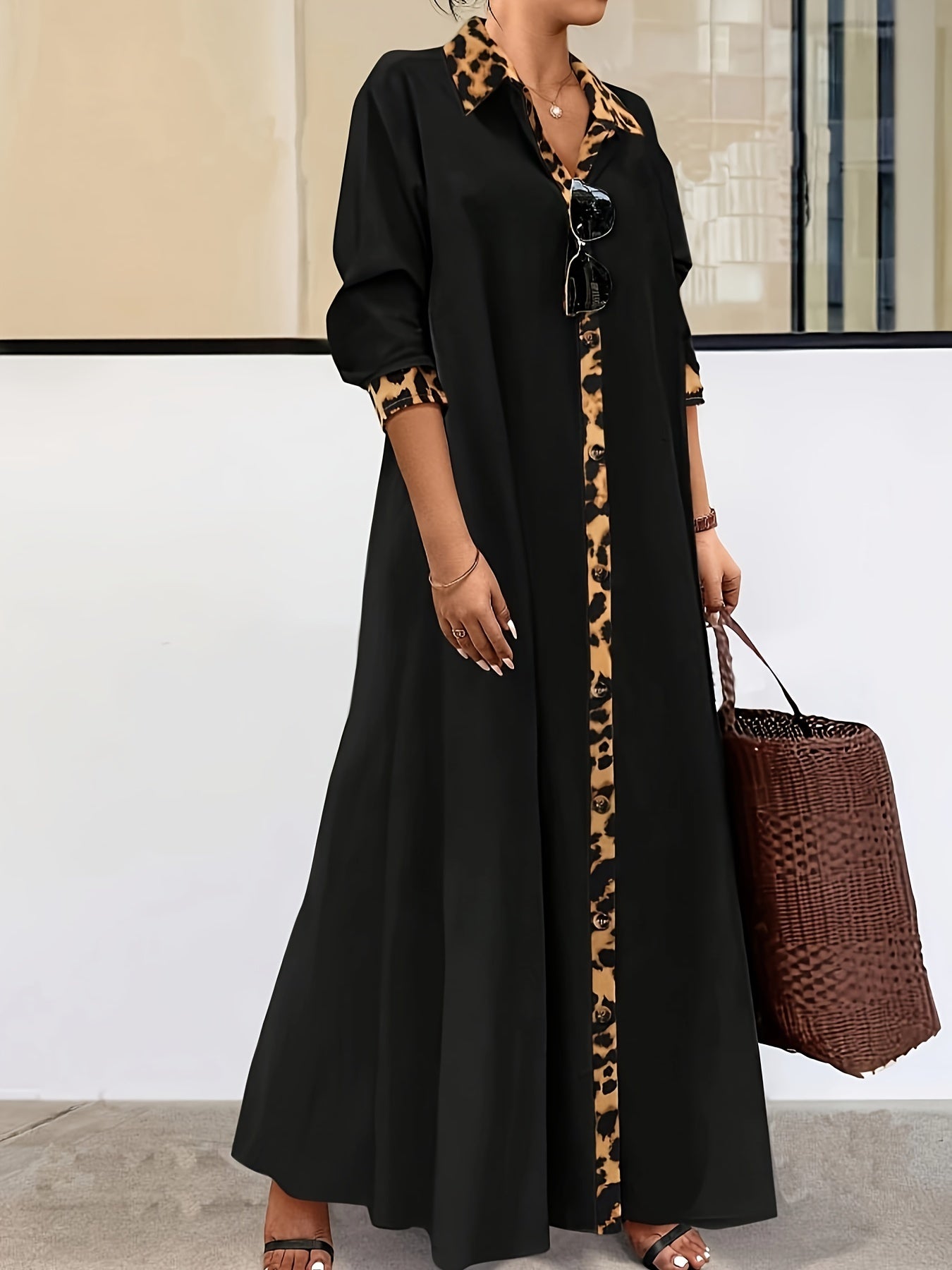 Chic plus size maxi dress with leopard print trim. Long sleeve button-up collar, black & tan animal print, 100% polyester, machine washable. Ideal for spring and fall. Cute dress.