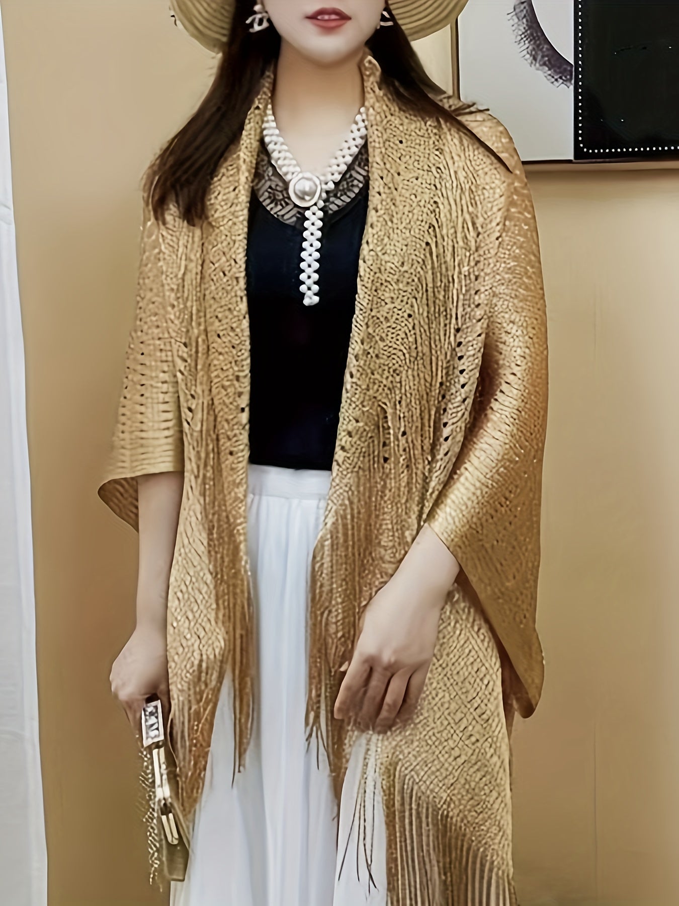 Stylish plus-size cardigan with tassel details, hollow-out design, and sun protection shawl. Made of polyester - hand or dry clean only.