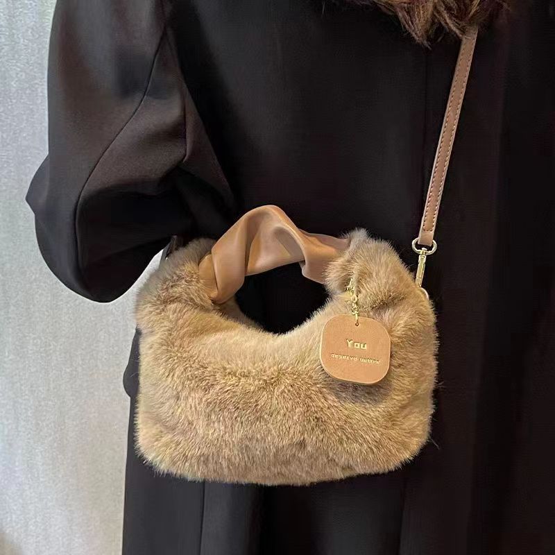 Stylish plush crossbody bag for women in faux fur with adjustable strap and zip closure. Perfect for fall/winter in khaki, light grey, dark khaki, cream, or pink.