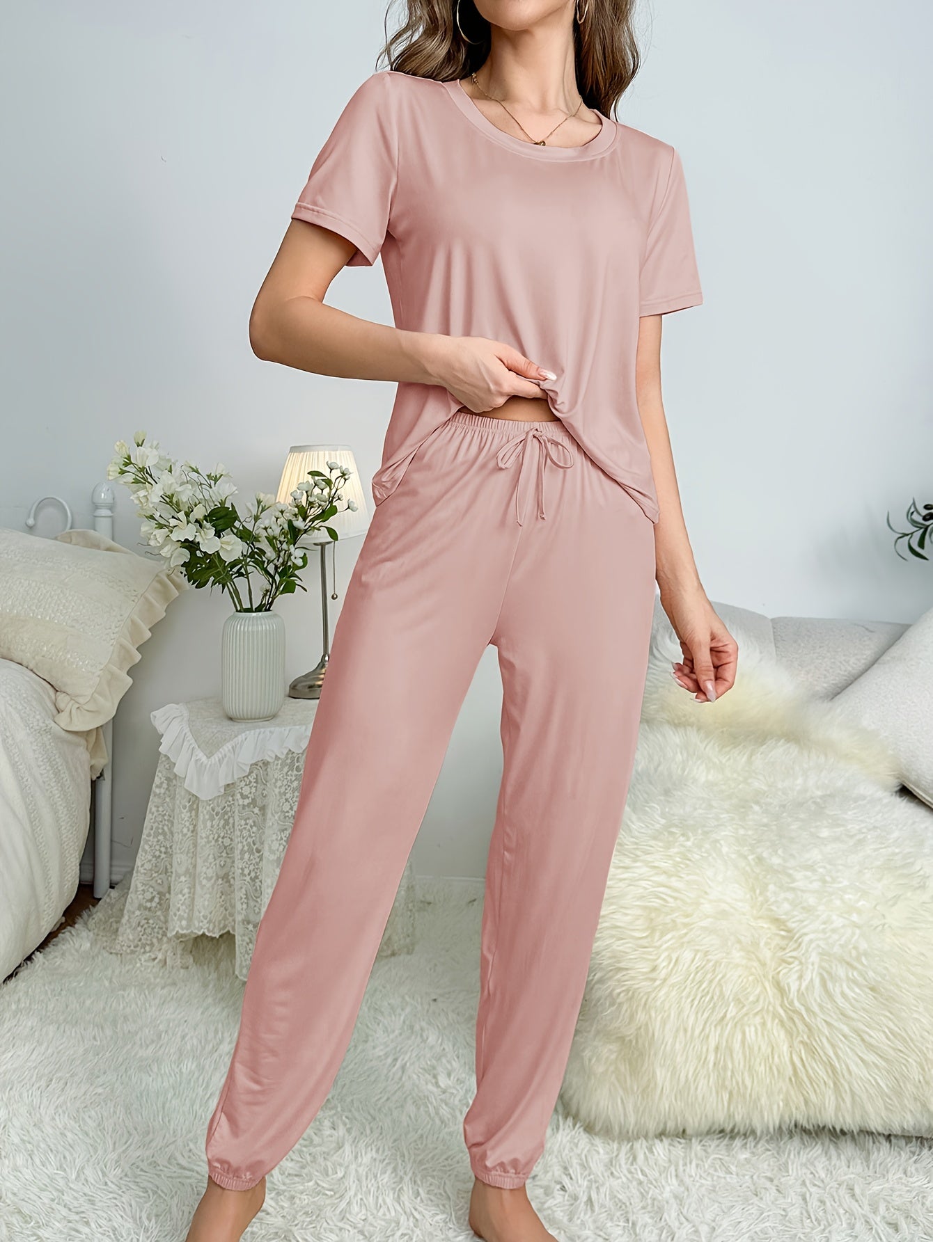 Cozy lounge set with short sleeve top and elastic drawstring pants for women's sleepwear.