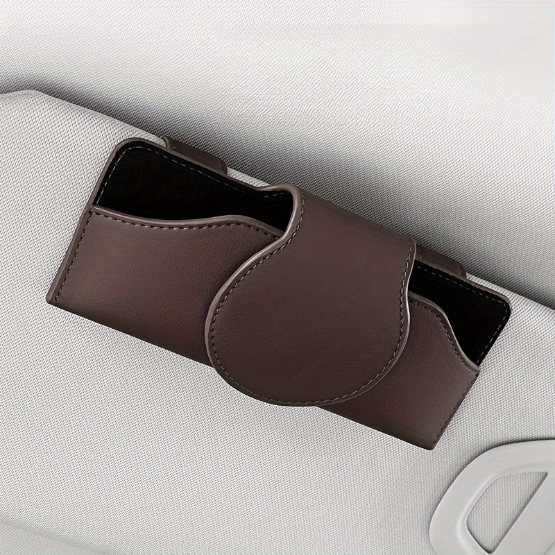 Car visor glasses holder with magnetic closure, PU leather eyeglasses storage clip, vehicle sun visor organizer with strong adsorption.