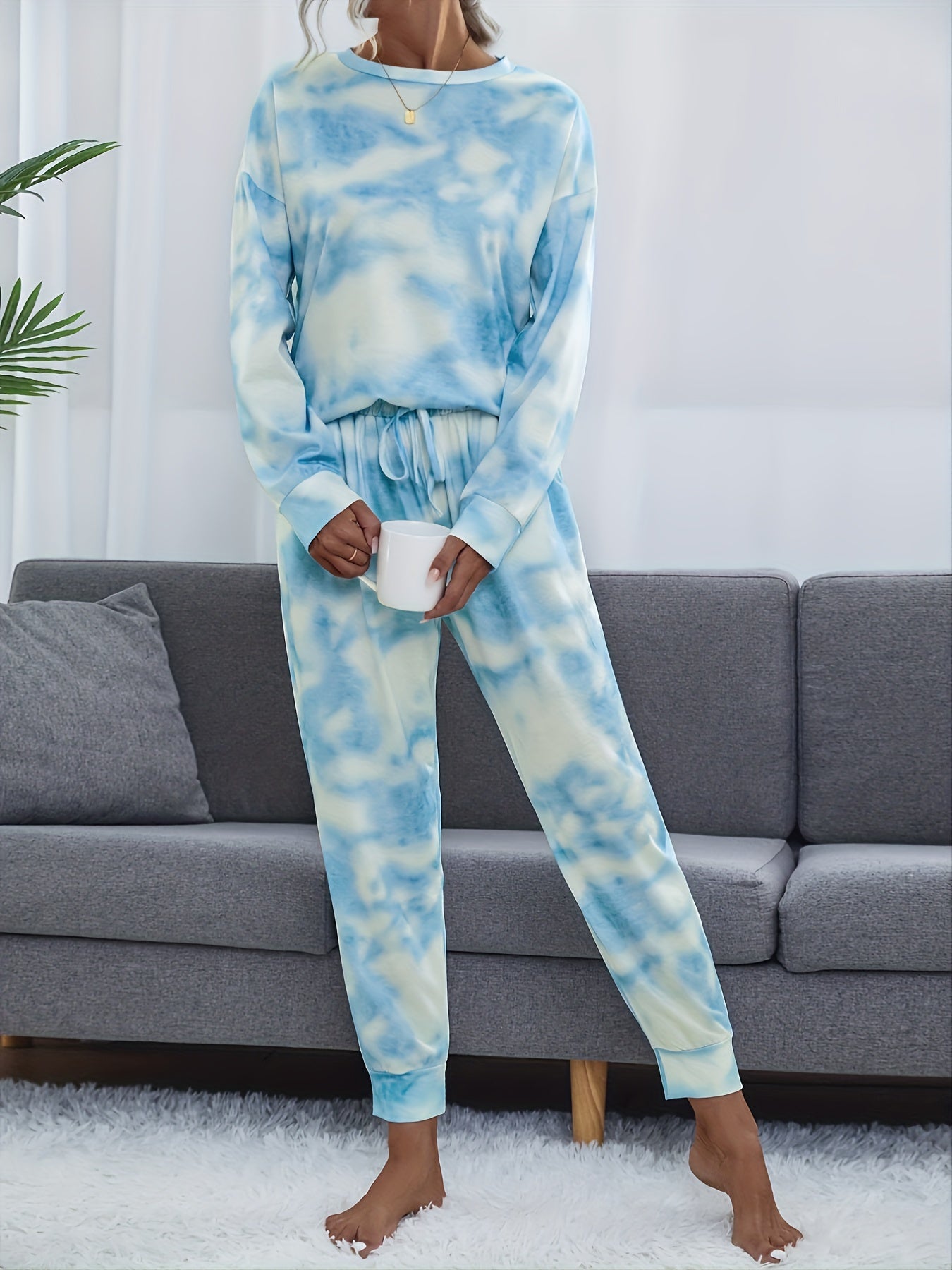 Tie dye lounge set for women, with long sleeve top and elastic waistband pants.