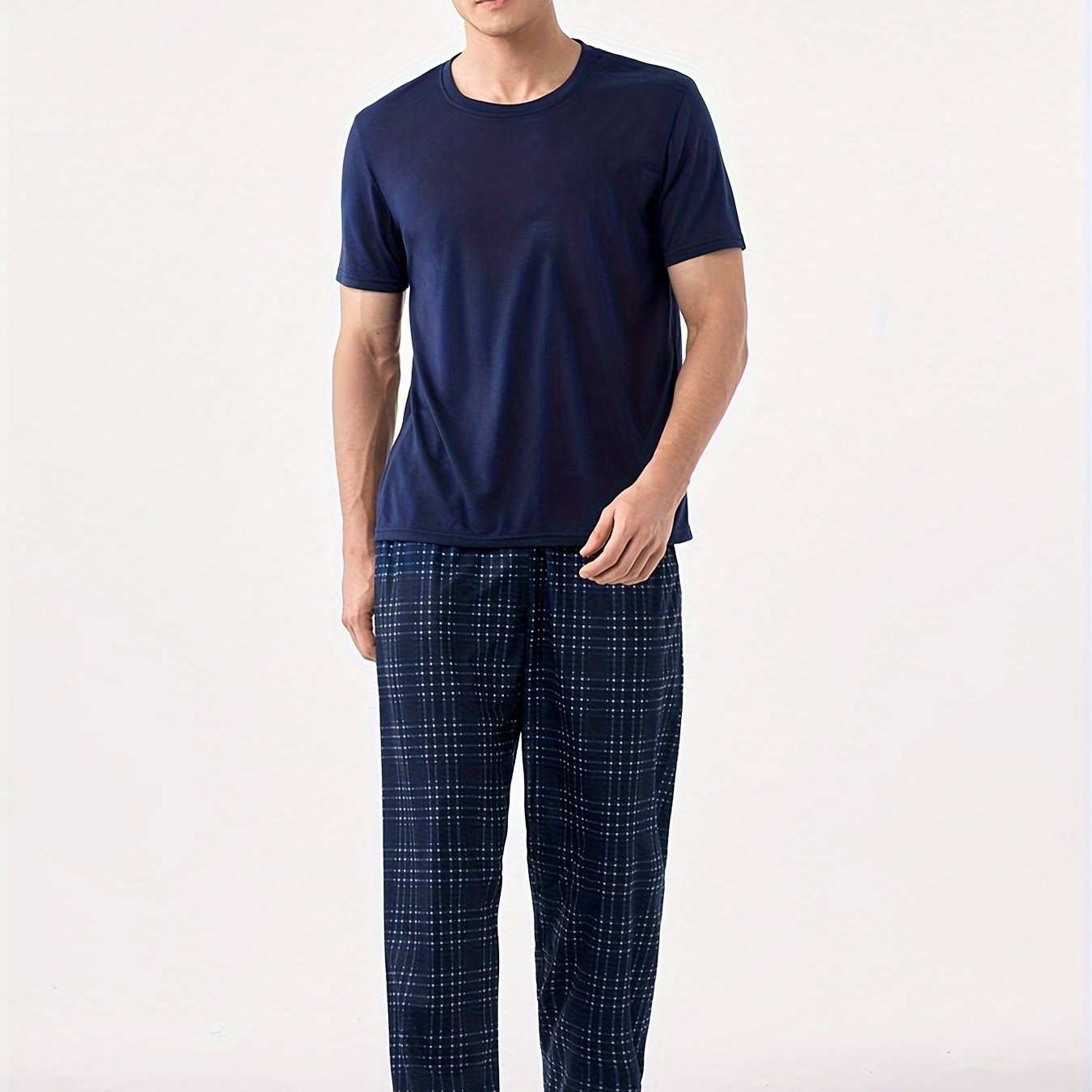 Men's blue pajama set with classic round neck, short sleeves, and plaid trousers for cozy loungewear.