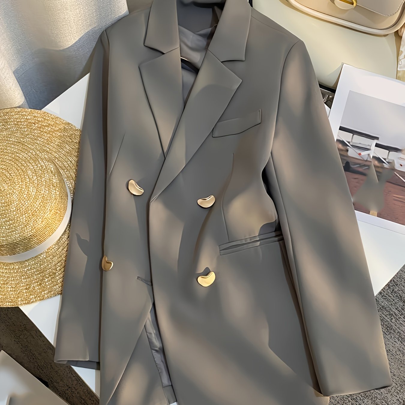 Stylish women's blazer with a British-inspired, casual French design, featuring long sleeves, double-breasted closure, and made of polyester - ideal for transitioning between seasons.