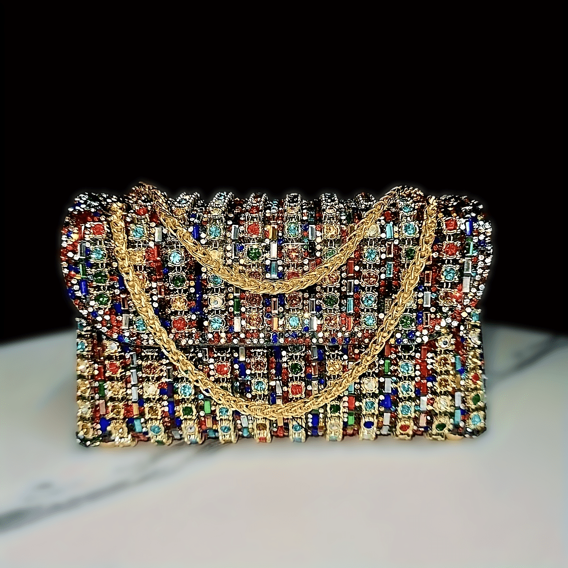 Stylish women's evening clutch with rhinestones and beads, adjustable strap, and magnetic closure, perfect for formal events.