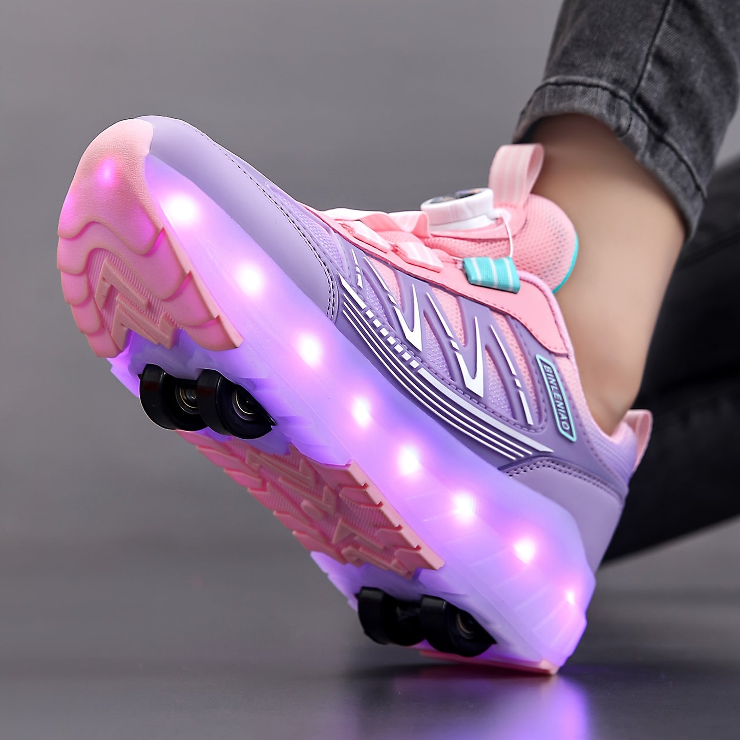 Pink and purple LED light-up skateboard shoes for girls with 8 wheels and 16 flash modes. Breathable and lightweight, with fabric lining, EVA sole, and rotary buckle closure. Suitable for