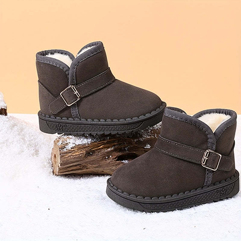 Children's winter boots with cozy fleece lining, warm and breathable, slip-on style with metal buckle straps, available in black and brown for boys and girls.