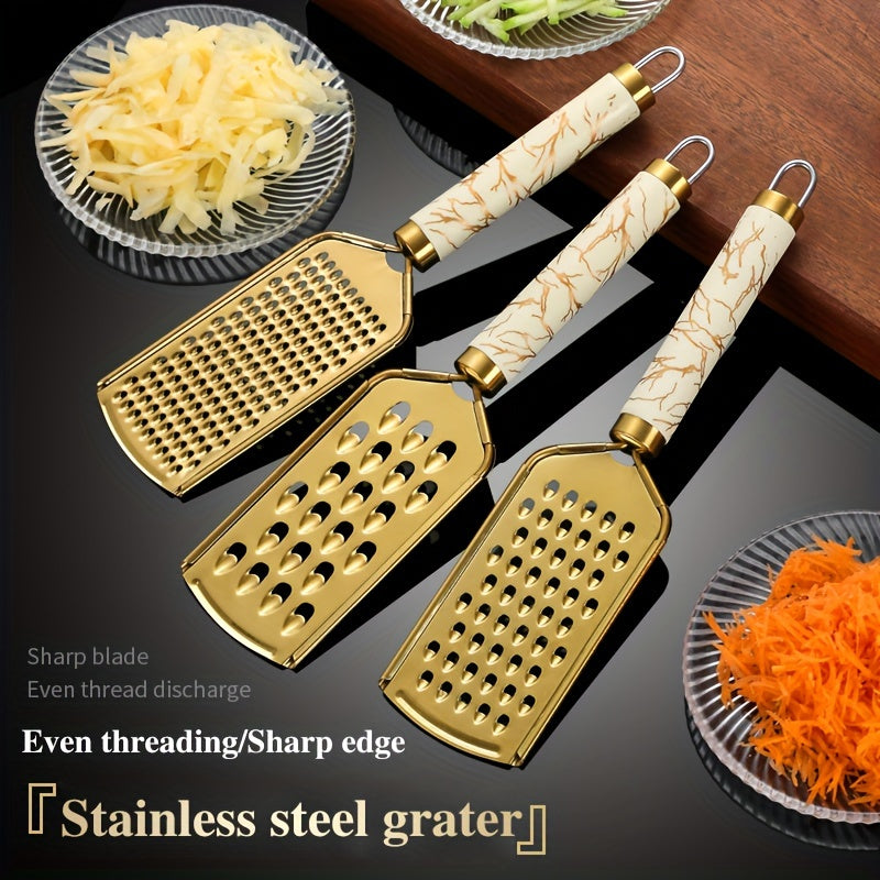 Stainless steel kitchen grater for shredding various foods, with a safe handle and luxurious golden appearance.