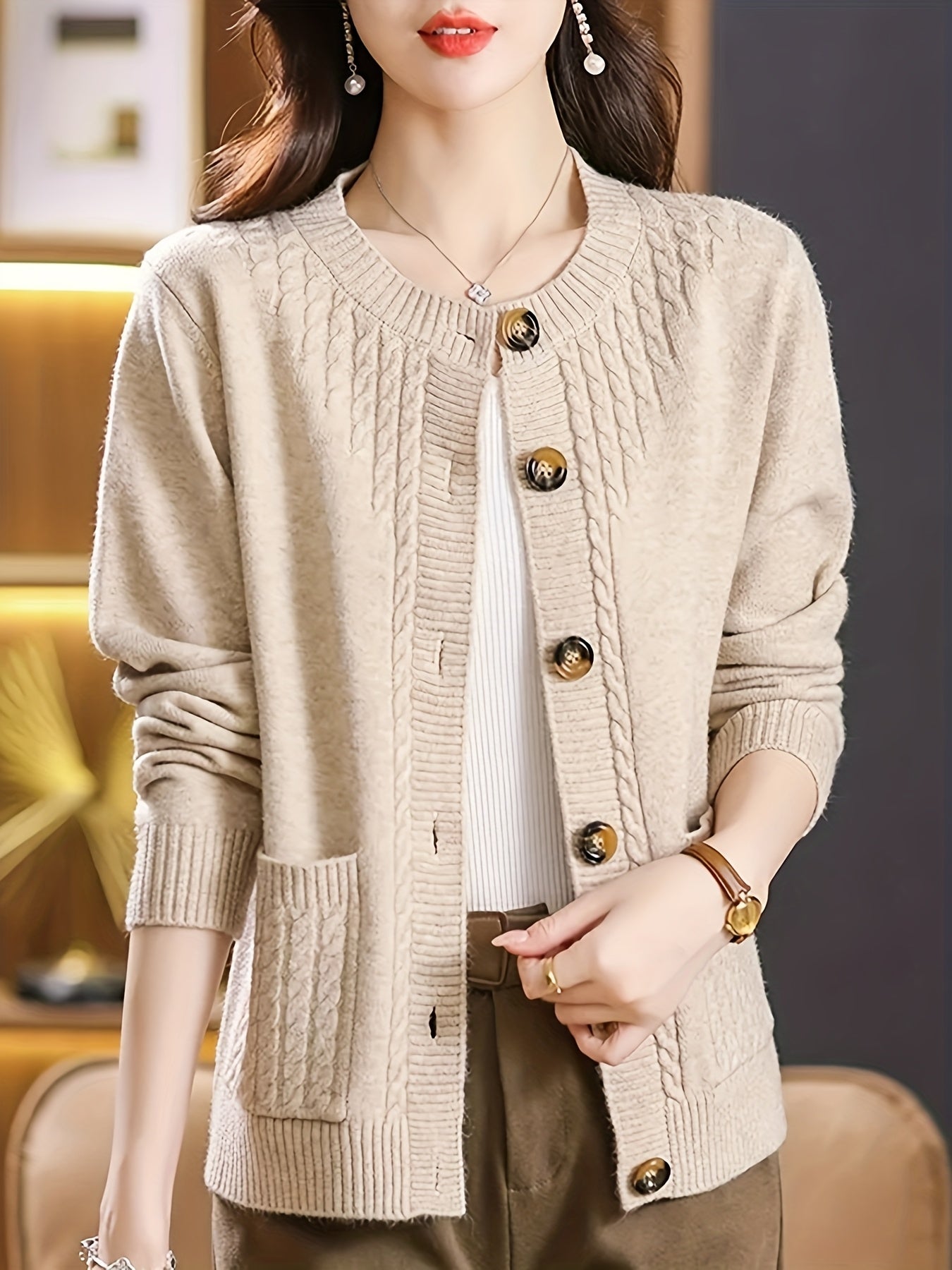 New Spring Collection for Women: Loose-fitting cardigan with round neck, solid color, and unique design, featuring long sleeves.