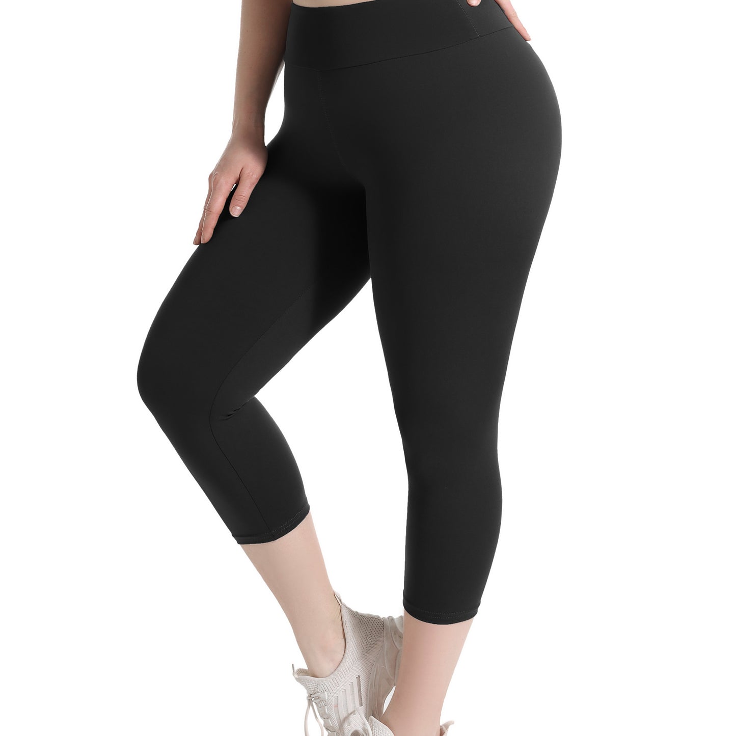 Plus size capri leggings for women, with high waist and tummy control. Features 4X stretch, pocket detail, and solid black color. Made from knit fabric, 92% polyester and 8% spandex