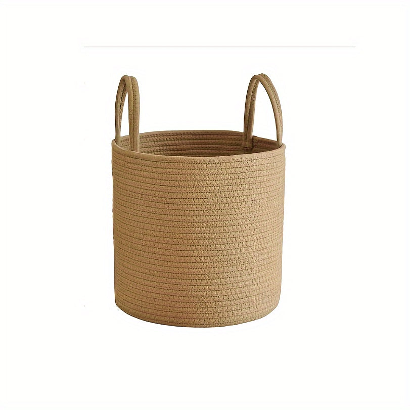 Large capacity rustic cotton rope woven laundry basket with a modern style, perfect for organizing clothes in your home. This round-shaped basket has handles for easy transportation and is ideal for use in the laundry room. No lining included.