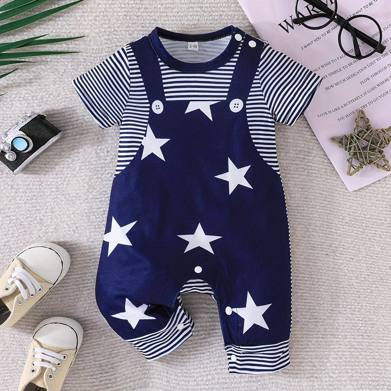 Baby's faux two-piece cartoon star print bodysuit, casual short sleeve romper for outdoor wear.