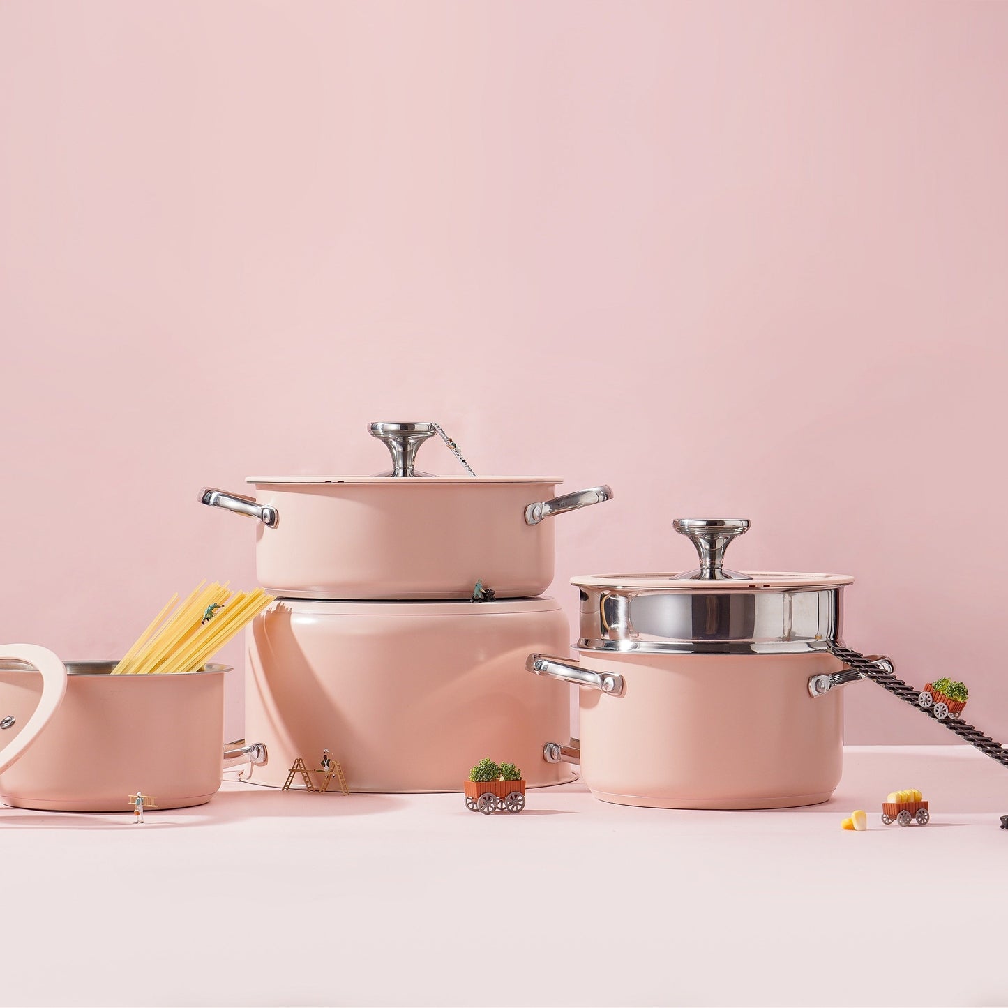 Cook your favorite meals with this stainless steel cooking pot set, which includes a sauce pan, soup pot, casserole, and steamer pot in beige, white, pink, or green. These pots feature a ceramic spray coating and are compatible with induction/electric