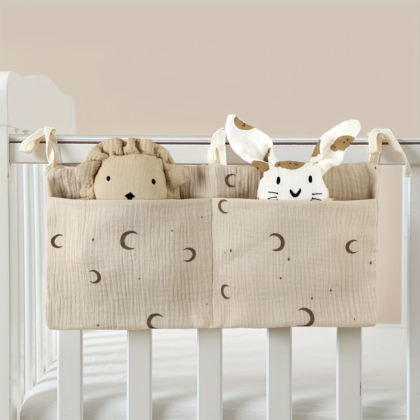 Double-layer fabric hanging storage bag with two stroller pockets, ideal for holding baby bottles with printed patterns.