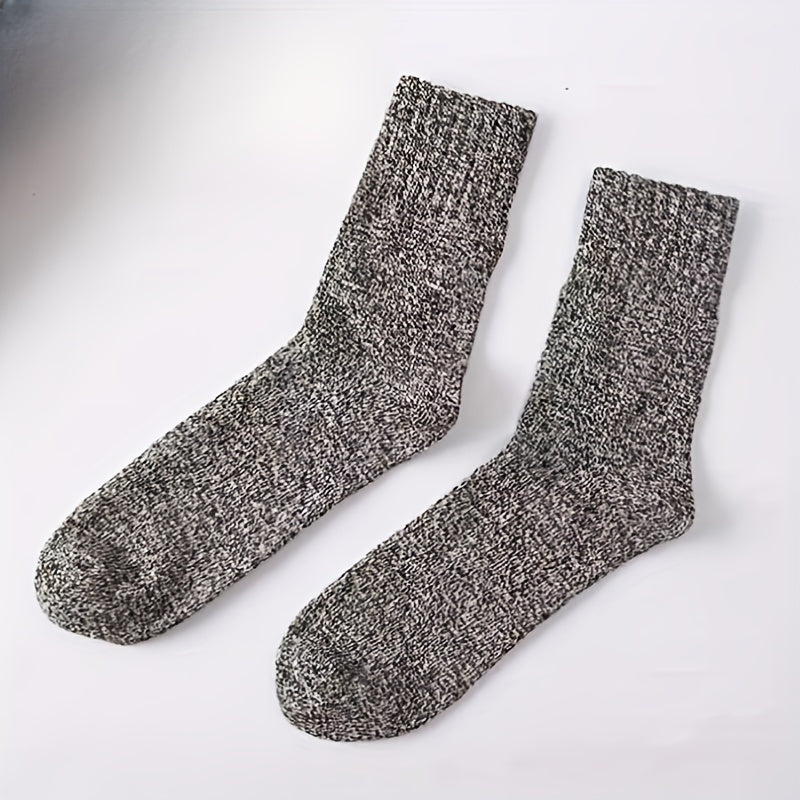 3 pairs of men's winter socks for warmth, made of thick towel material, mid-calf length, suitable for cold weather and snow boots. Fits sizes 39-44, polyester blend with elastic, solid