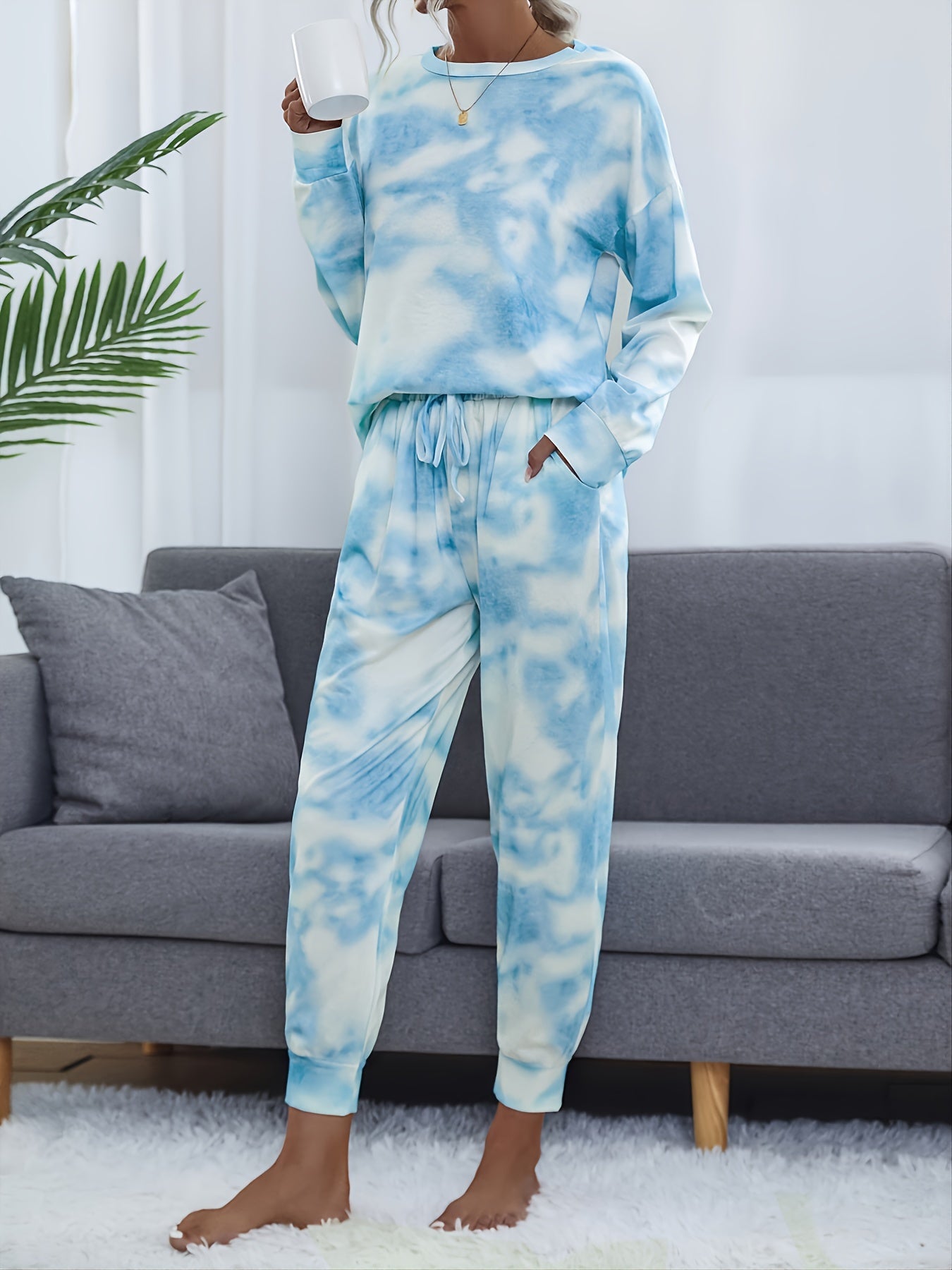 Tie dye lounge set for women, with long sleeve top and elastic waistband pants.