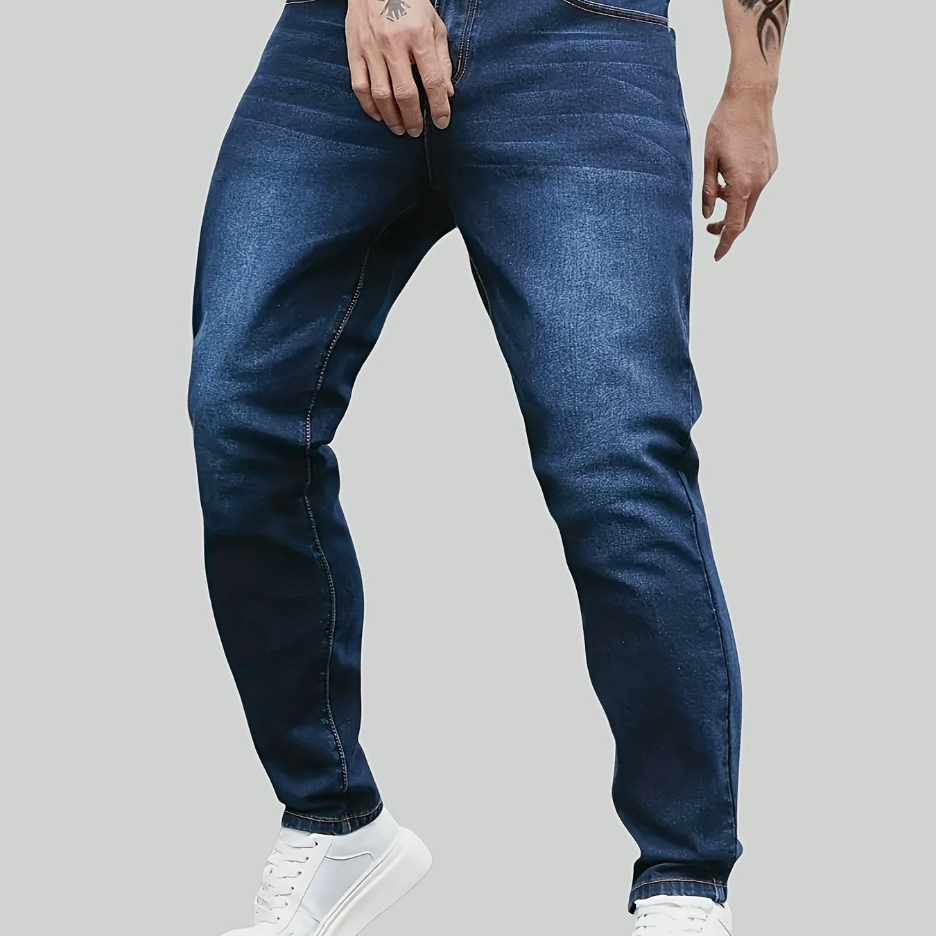 Men's denim jeans in plus size with a straight leg cut, made of 65% cotton, 33.7% polyester, and 1.3% spandex. Features medium stretch, all-season comfort, solid washed style, and 370gsm