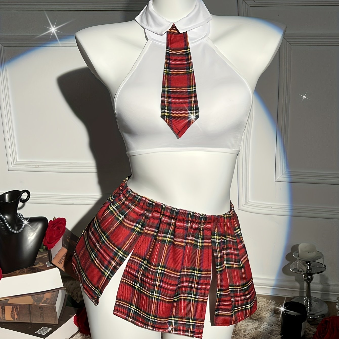 4-piece plaid uniform set for women with crop top, tie, thong, and skirt with bow detail - great for cosplay and lingerie.