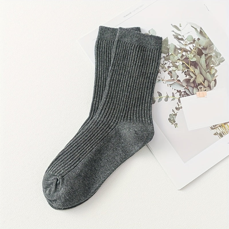 Men's solid color socks in a multi-pack of 2 or 5 pairs, breathable mid-calf sports socks suitable for all seasons. Trendy and boneless design.