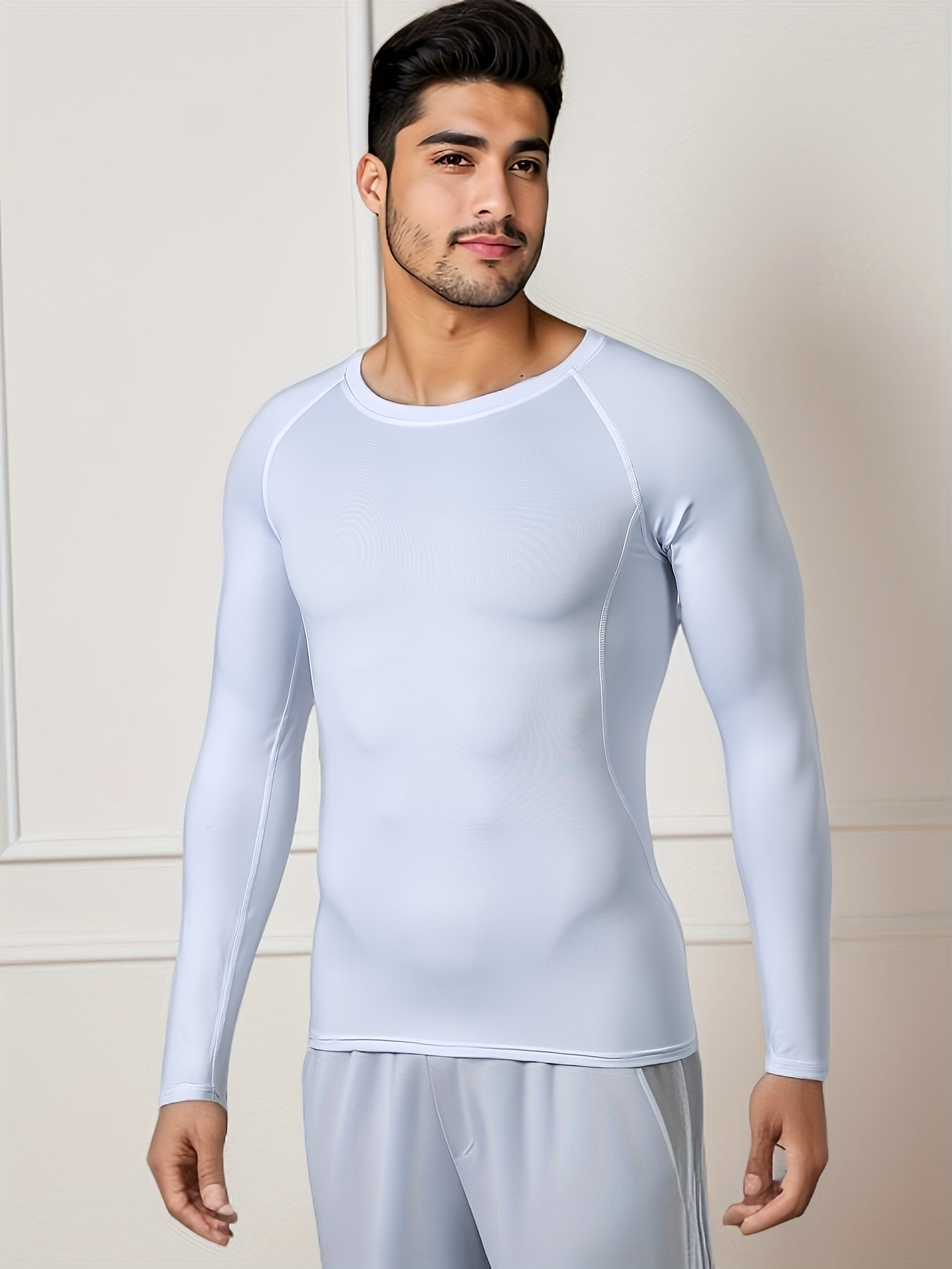 Men's Thermal Underwear Set for skiing in winter, with long sleeve top and bottom pants.