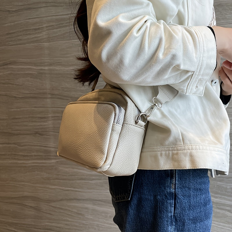 Women's stylish crossbody bag in deep brown, cream white, or black. Features zipper closure and polyester lining.