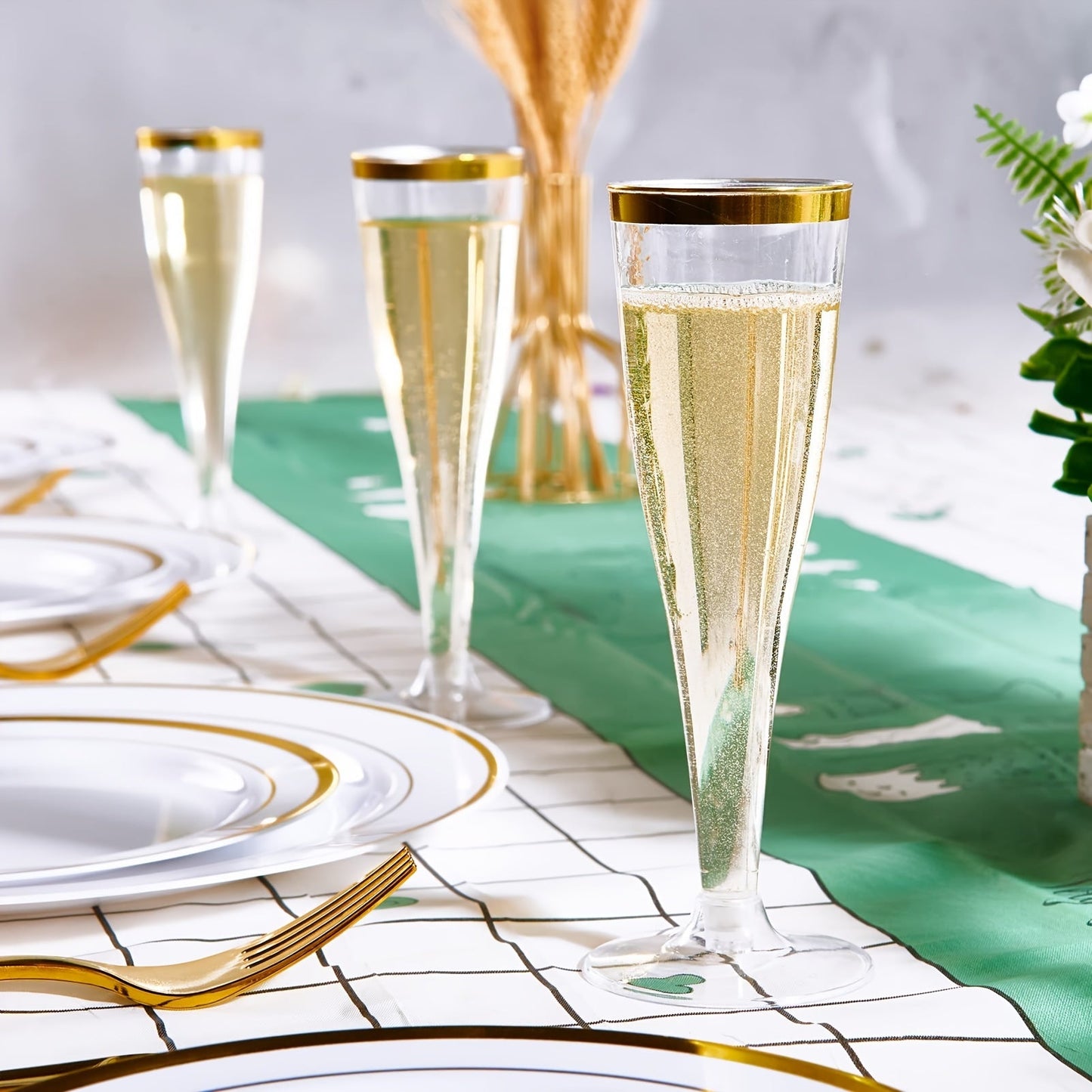 20-Pack of elegant plastic champagne flutes with golden rims, each holding 4.5oz of liquid. These recyclable and reusable toasting glasses are perfect for weddings, birthdays, and bridal showers. Versatile and convenient, these premium disposable