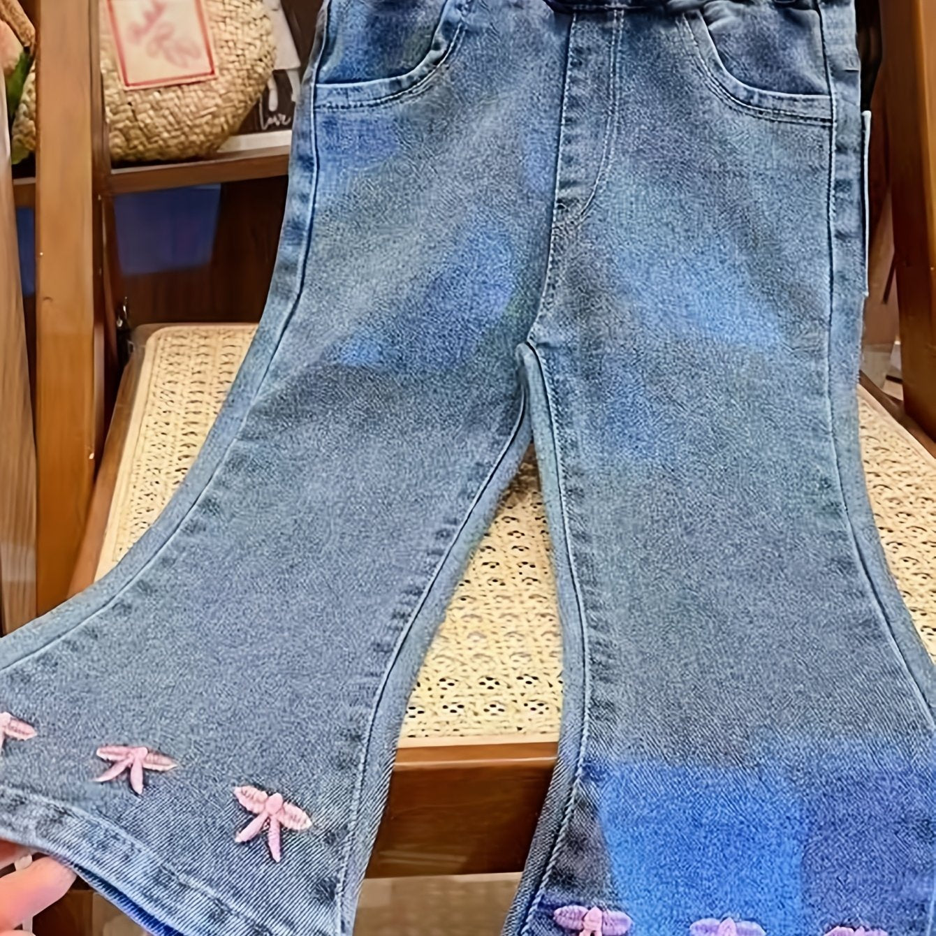 Cute bow-knot denim jeans for baby girls. Made with soft knit fabric, cotton blend, machine washable. Ideal for spring and fall.