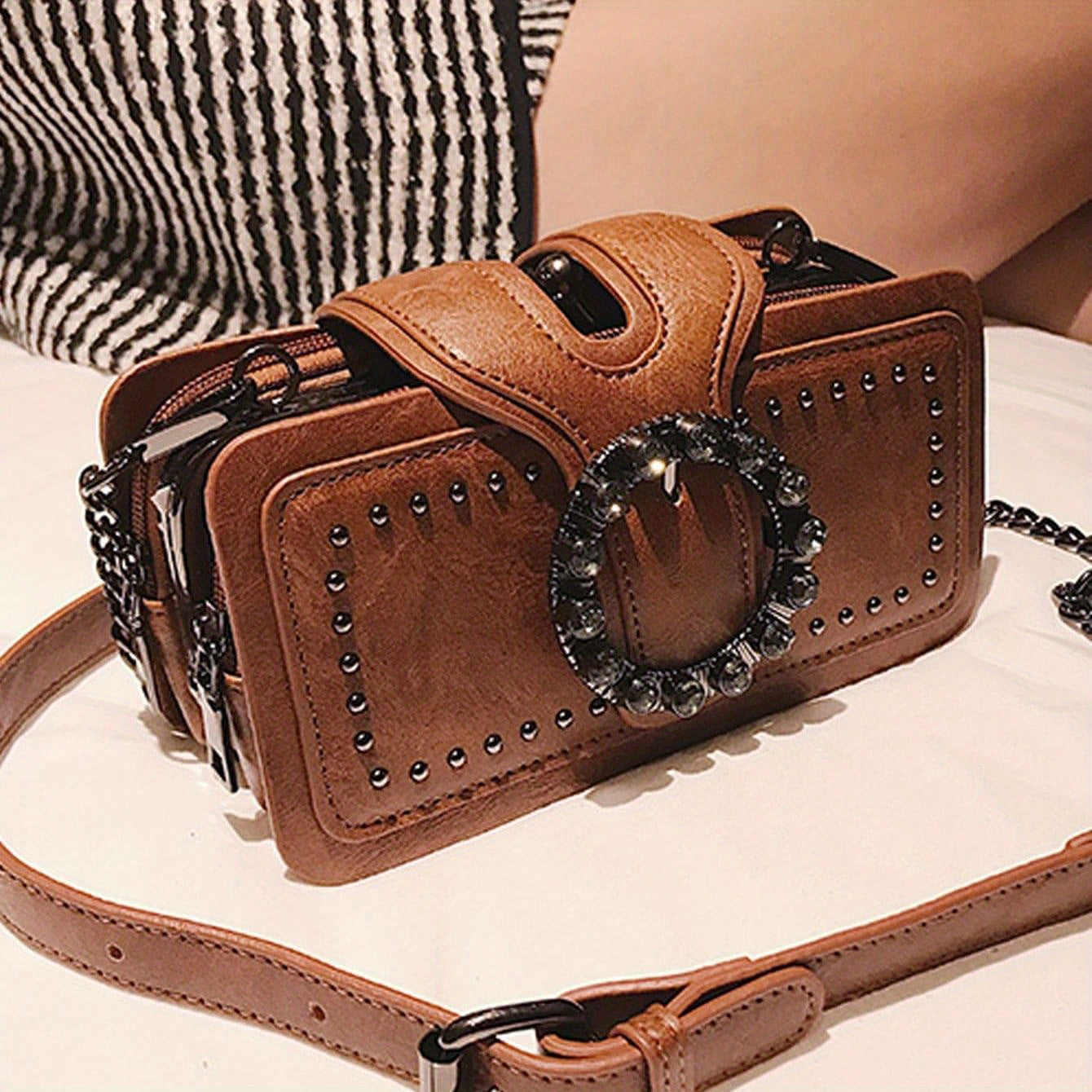 Women's retro clutch bag with rivets, chain shoulder strap, black color, multi-layer clip, and small square design.