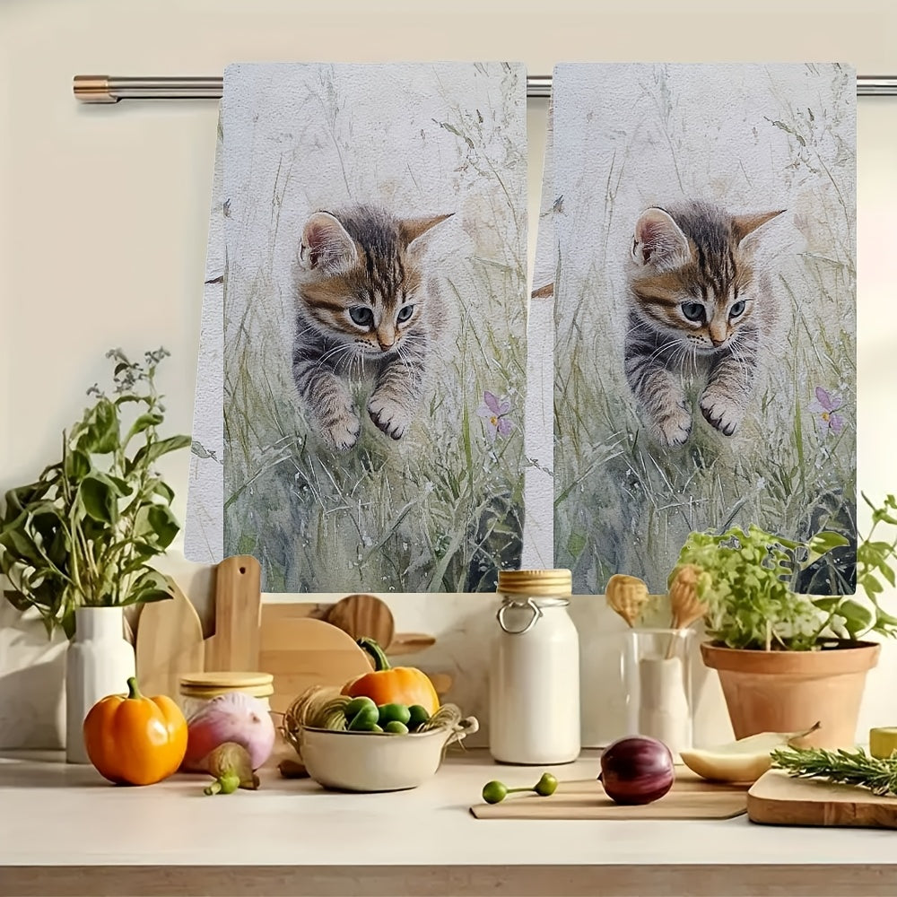 Two ultra soft kitchen towels featuring an adorable kitten in grass design. These towels are highly absorbent, machine washable, and perfect for adding a contemporary coastal touch to your kitchen decor. Each towel measures 40.64x60.96 cm. Perfect for