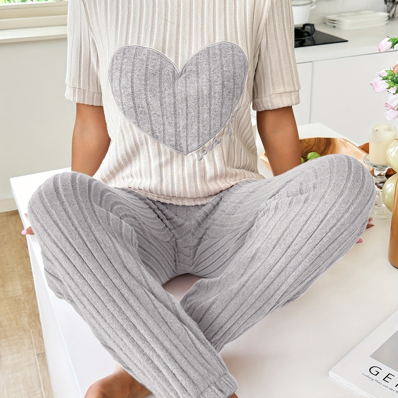 Women's heart and letter print pajama set with short sleeve top and joggers, relaxed fit for comfortable summer nightwear.