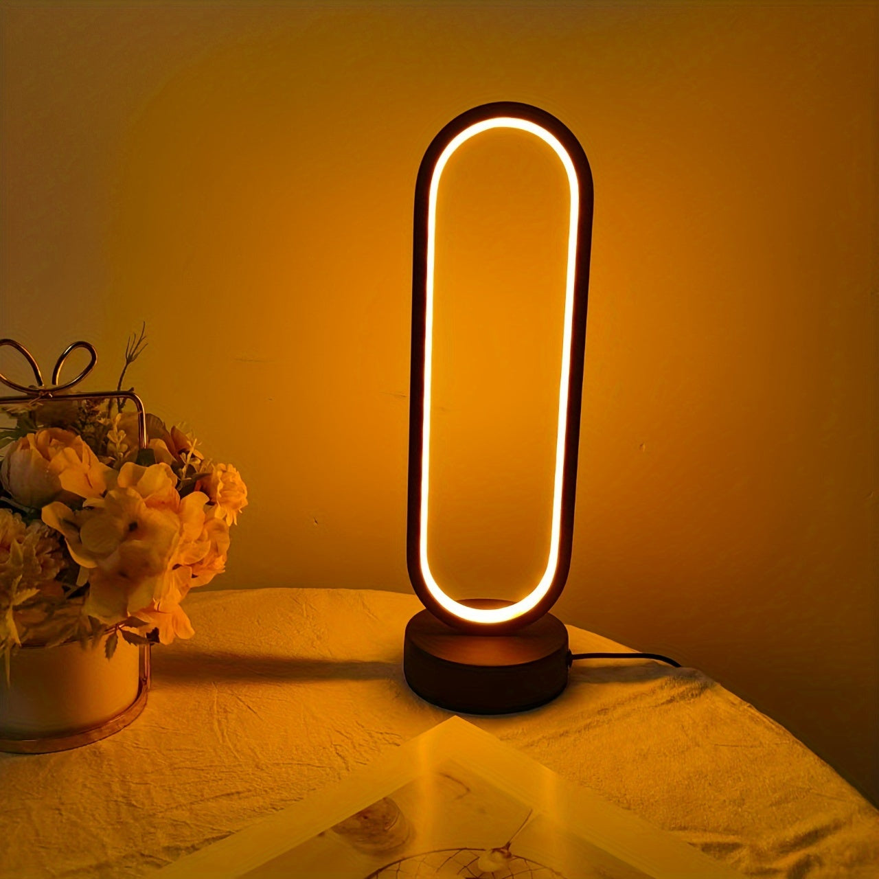 USB-powered LED ring table lamp in black or white; dimmable for bedroom and living room decor.