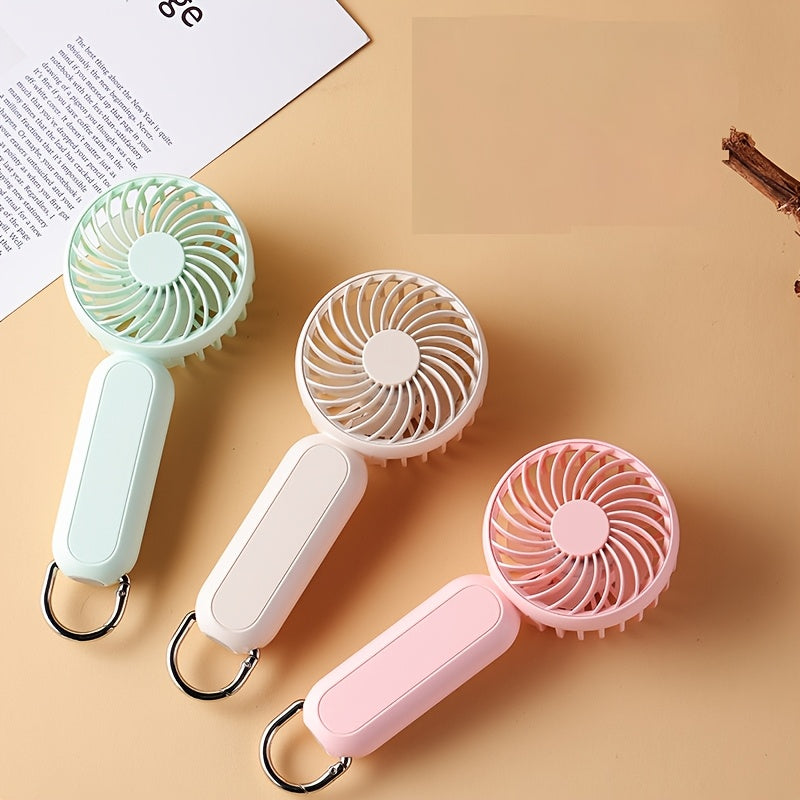 This mini portable fan is perfect for those on the go. It is handheld, personal, USB rechargeable, and battery-operated. You can bring it to the office, bedroom, outdoor travel, and camping. It also comes with a hook loop for easy carrying and