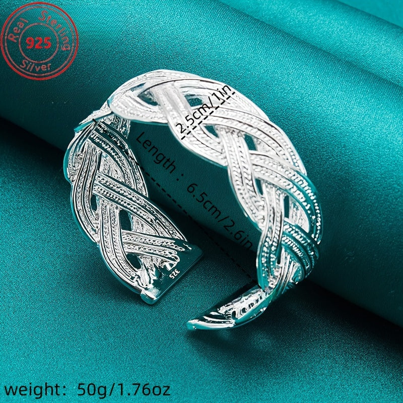 This bracelet is made of 925 sterling silver and features a woven design that is both stylish and elegant. It is adjustable and perfect for everyday wear, parties, birthdays, and Thanksgiving. This trendy piece of jewelry is a perfect gift for any female