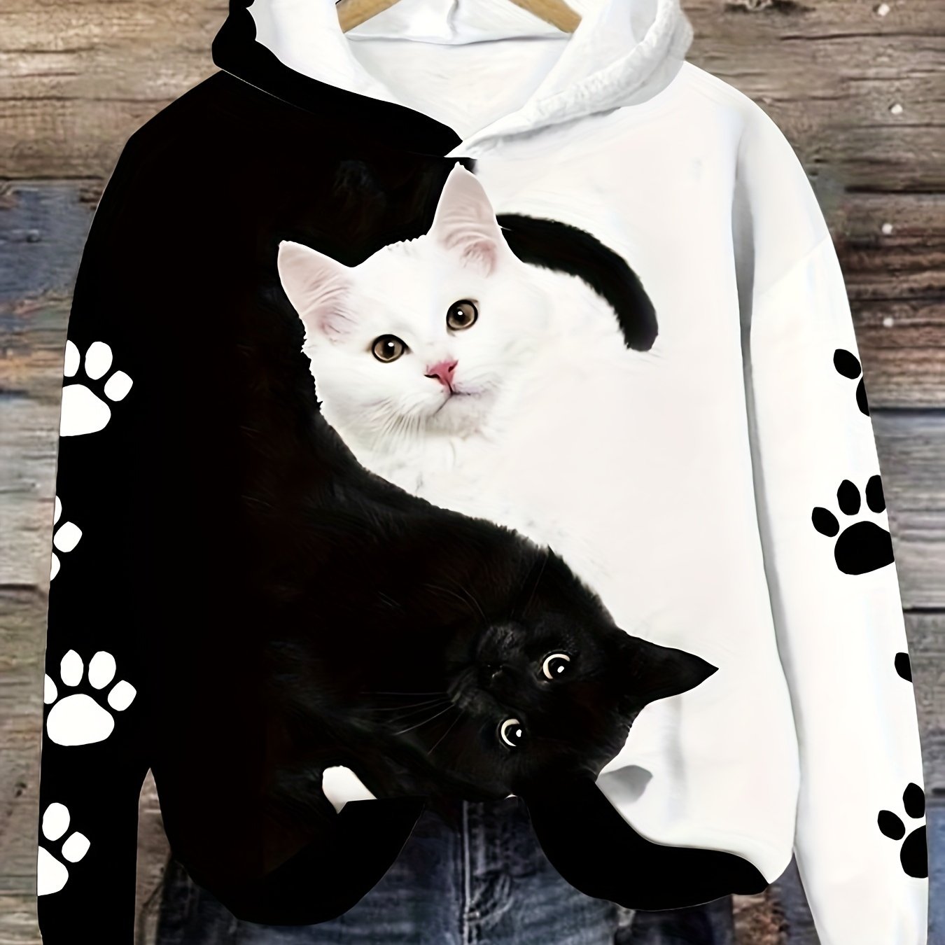 Cozy cat print hoodie for women, with kangaroo pocket, made of machine washable polyester blend.