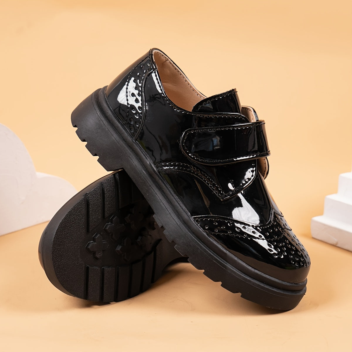 Breathable loafers for boys in shiny black PU with hook-and-loop closure, suitable for weddings, parties, and casual wear. Lightweight and comfortable for all seasons.