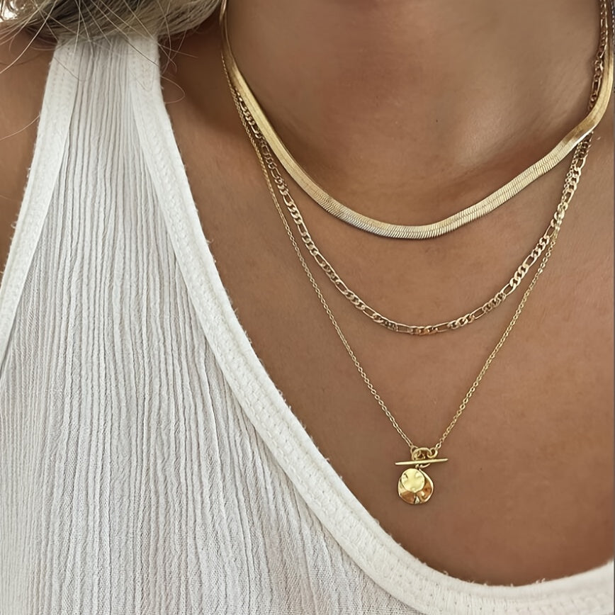 This stylish necklace set features 10 pieces with vintage heart and geometric pendants, complete with a snake chain and OT clasp. Ideal for everyday wear, special occasions, and gifting, this pendant necklace is the perfect accessory.