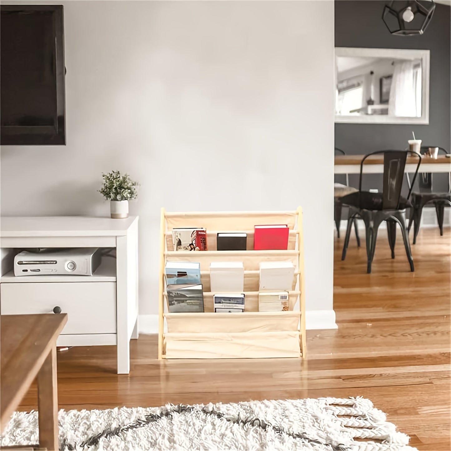 Wood bookshelf with fabric pockets and rounded edges, secured with screws.