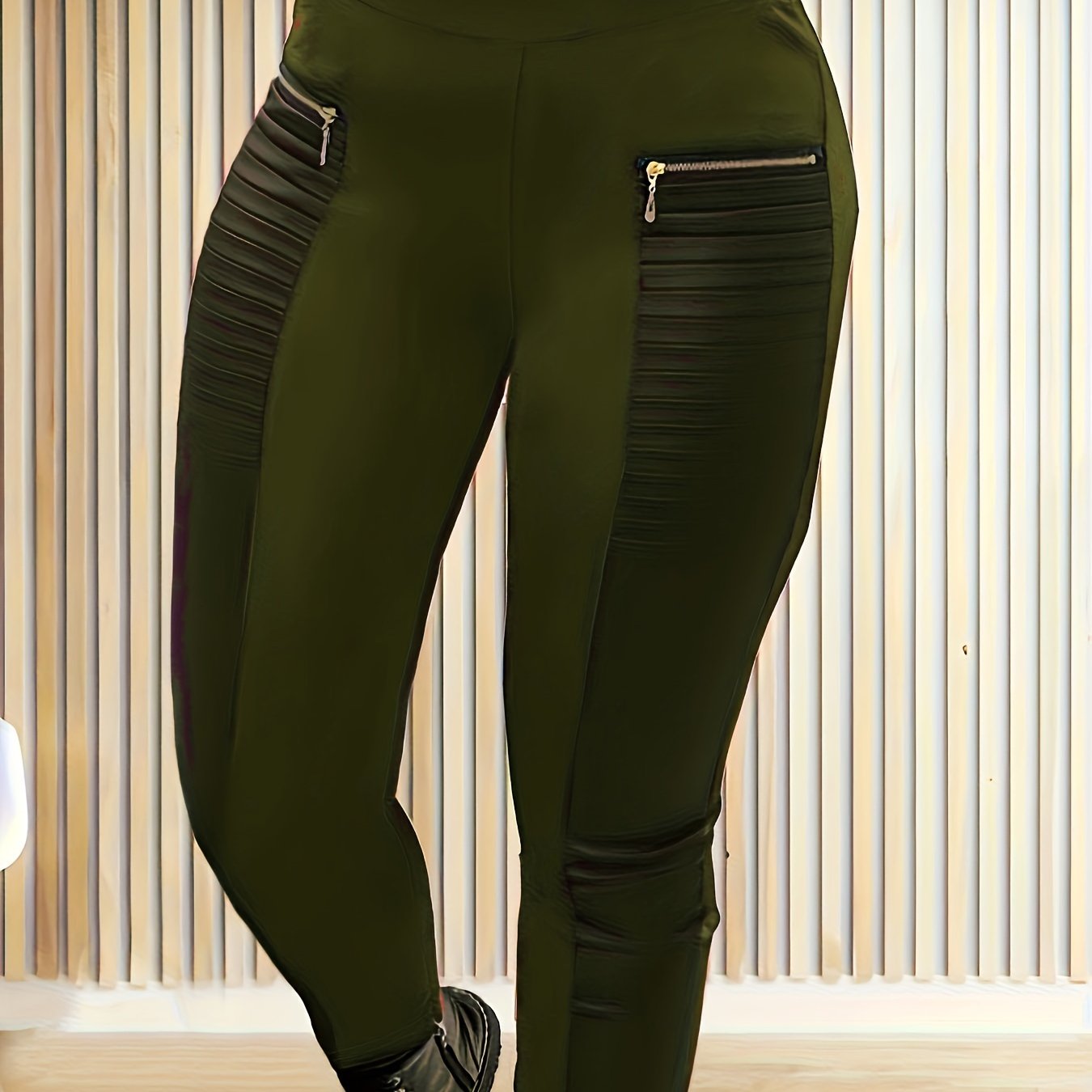 Plus size black tapered pants with golden zipper detail, high waist, stretchy polyester, casual solid color, machine washable, all-season comfort, flexible fashion, and sleek fabric.