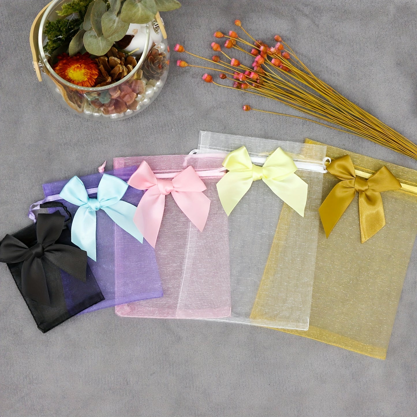 10 elegant organza bags with ribbon and bow, ideal for gift wrapping and party favors.